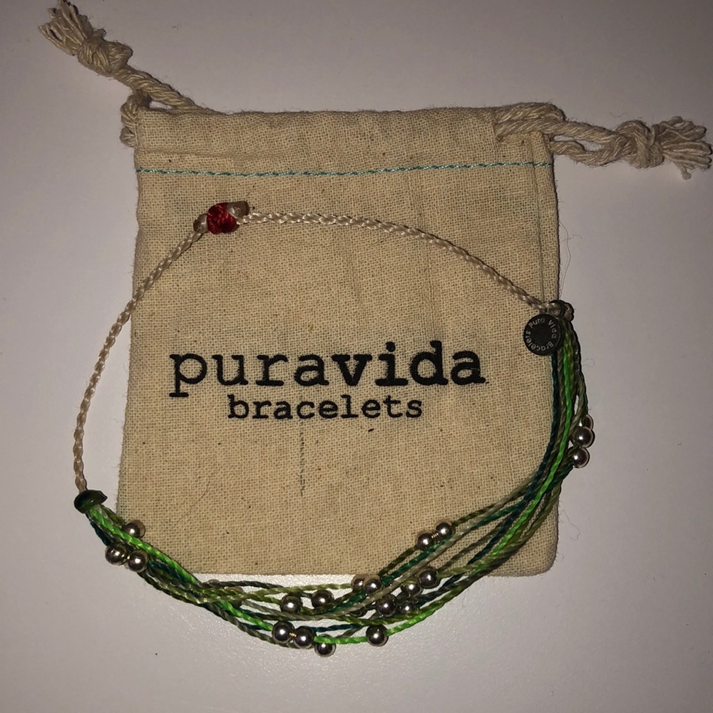 Green pura vida bracelet with bag